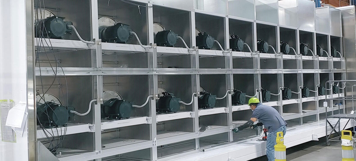 Man preforming maintenance on Nortek air handler